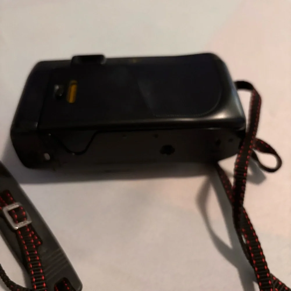 Nikon Black Camera with Red Accents and Case don’t know if it works